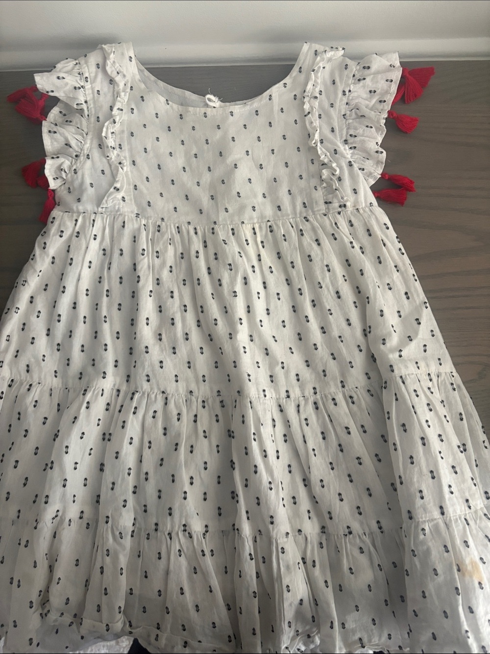 Girls White Tiered Dress with Navy Dot Print and Red Tassel Details